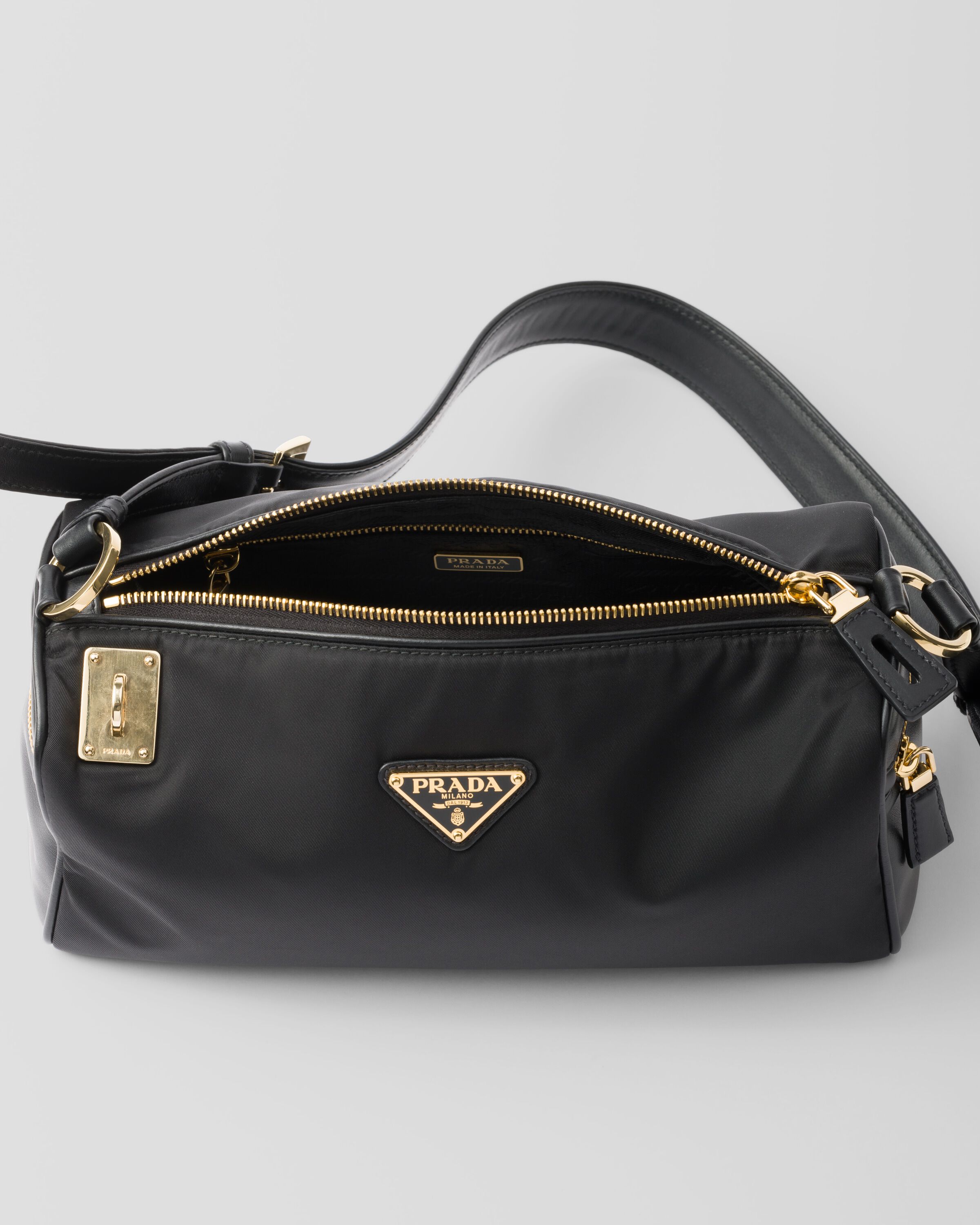 Prada Medium Re-Nylon and leather shoulder bag with padlock Prada Medium Re-Nylon and leather shoulder bag with padlock