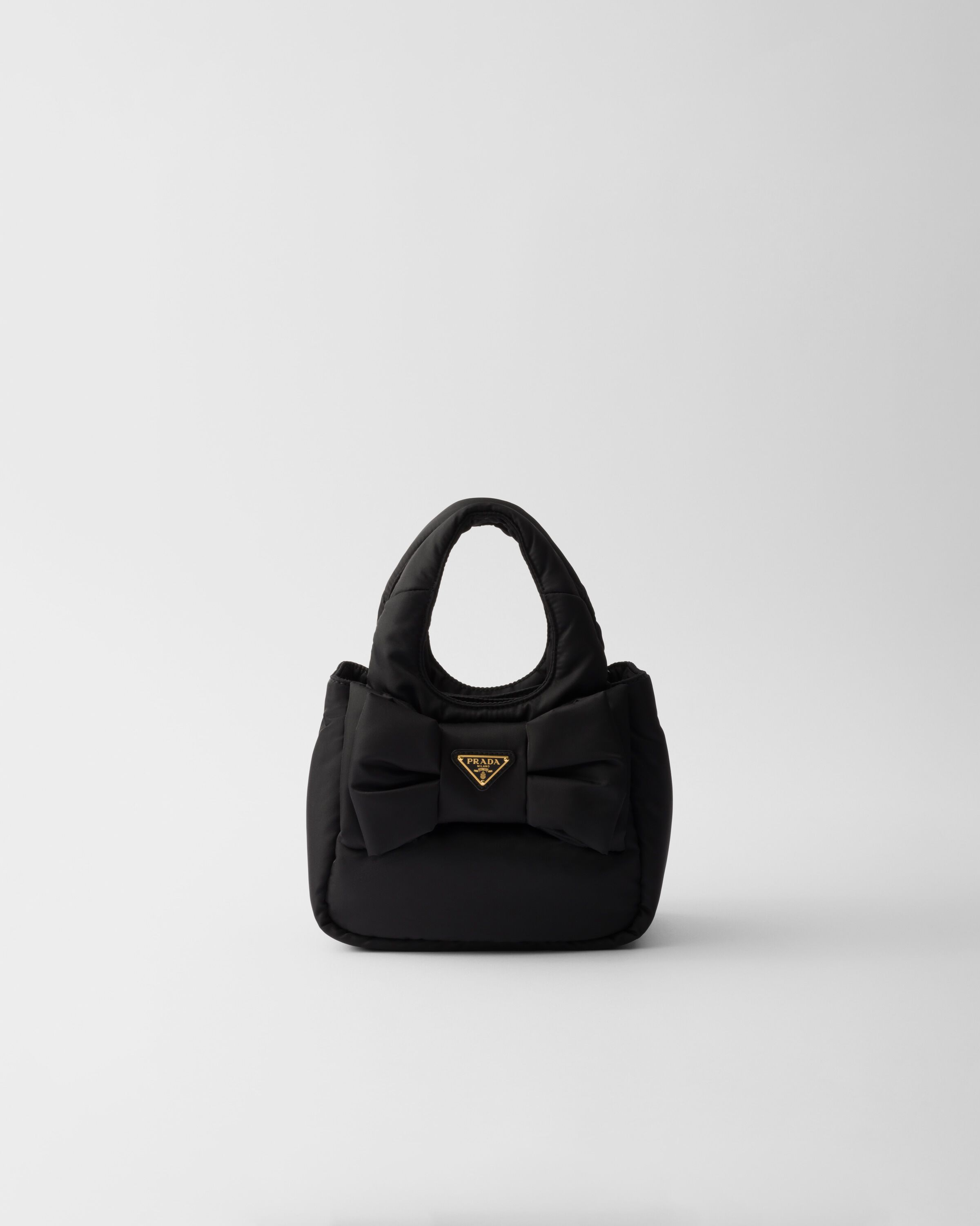 Prada Padded Re Nylon mini bag with bow Women Heathrow Reserve Collect