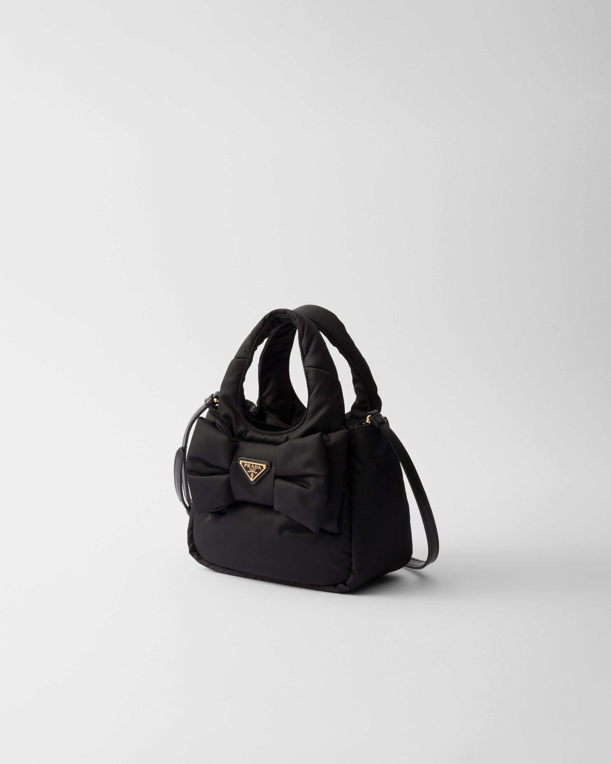 Padded Re Nylon mini bag with bow