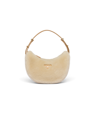 Prada Arqué shearling and leather shoulder bag