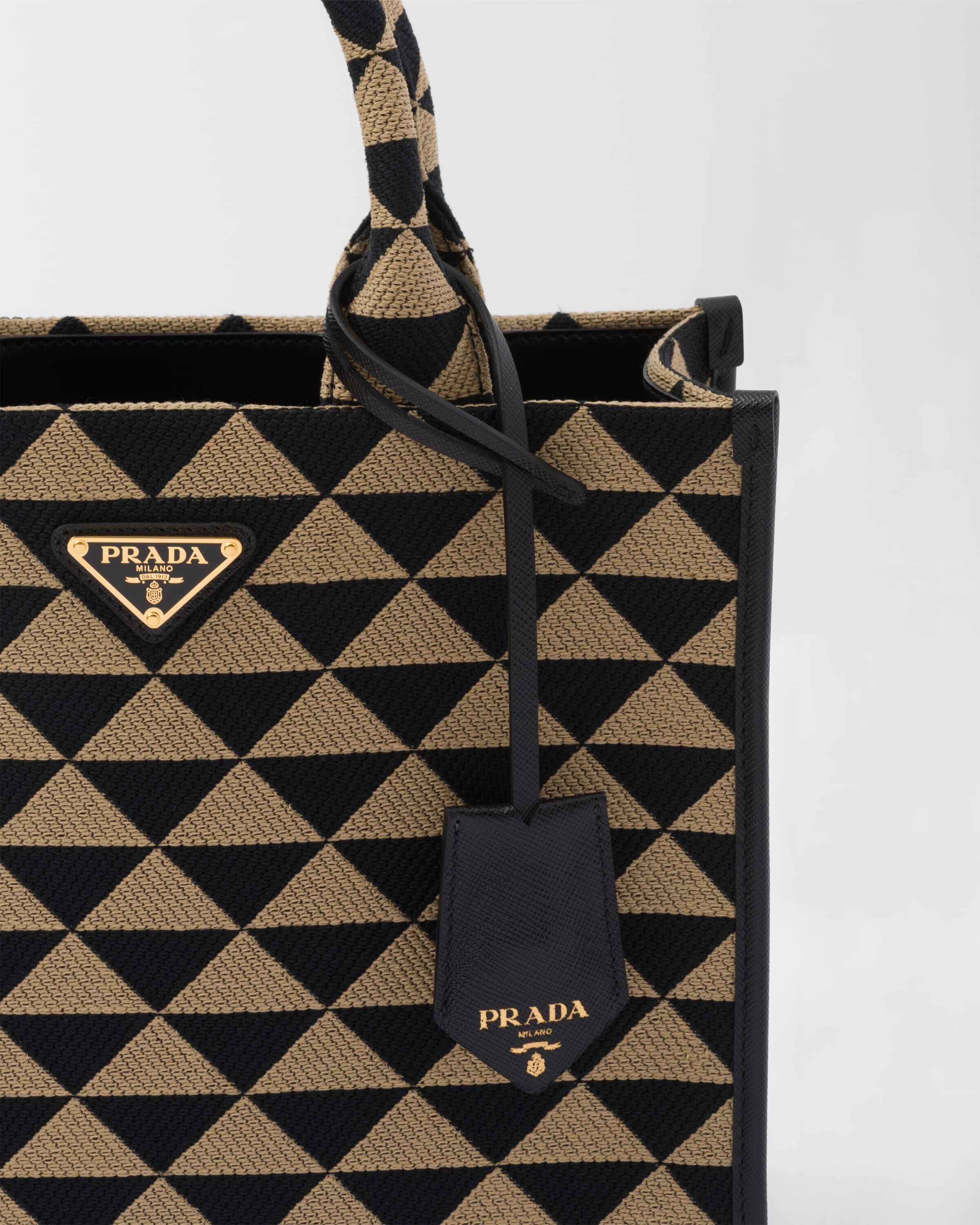 Small Prada Symbole embroidered fabric handbag