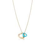 Elsa Peretti® Open Heart pendant in 18k gold and turquoise.