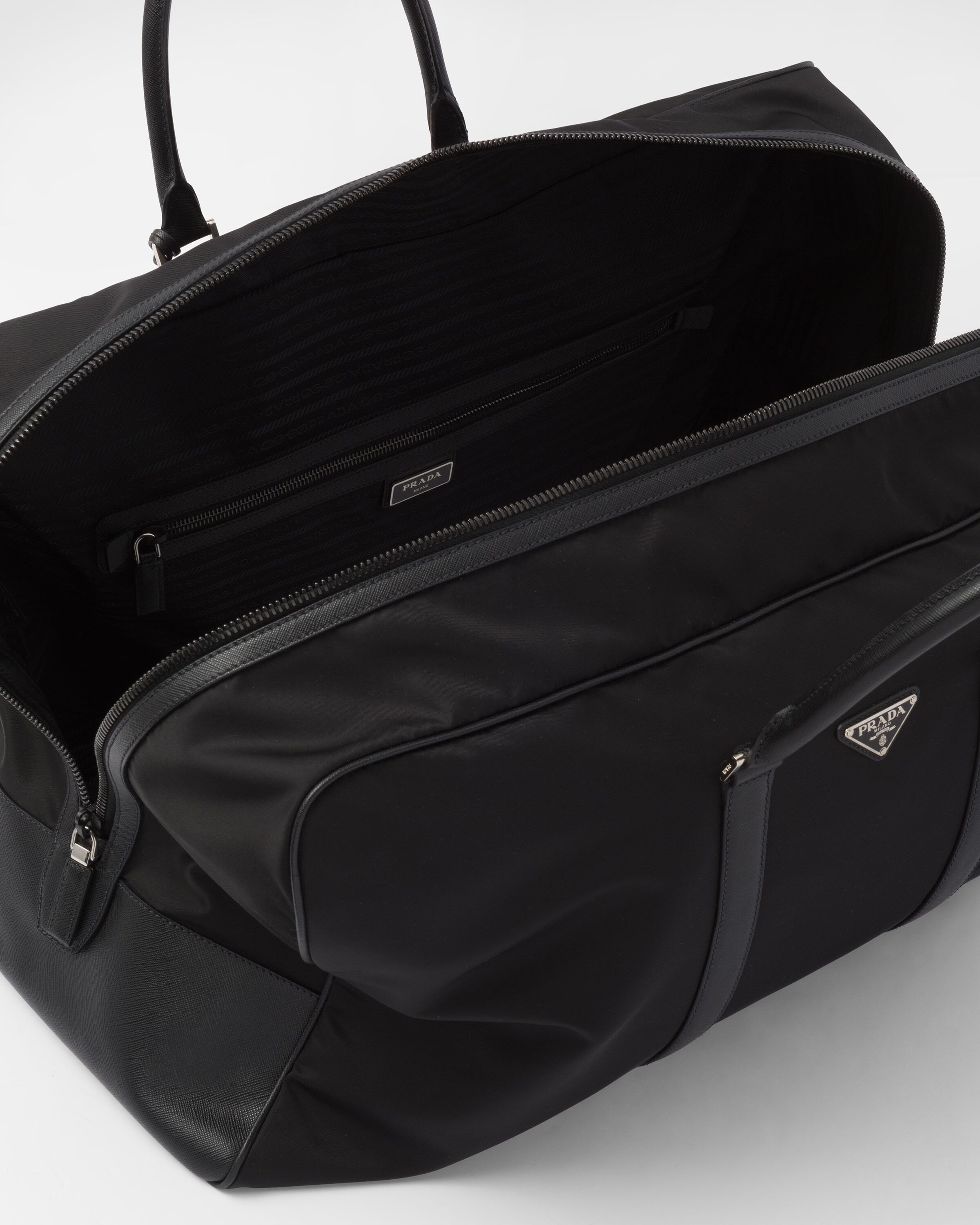 【関税&送料込】Prada Re-Nylon And Smooth Leather Duffle Bag Black Re-Nylon and Saffiano leather duffle bag | PRADA