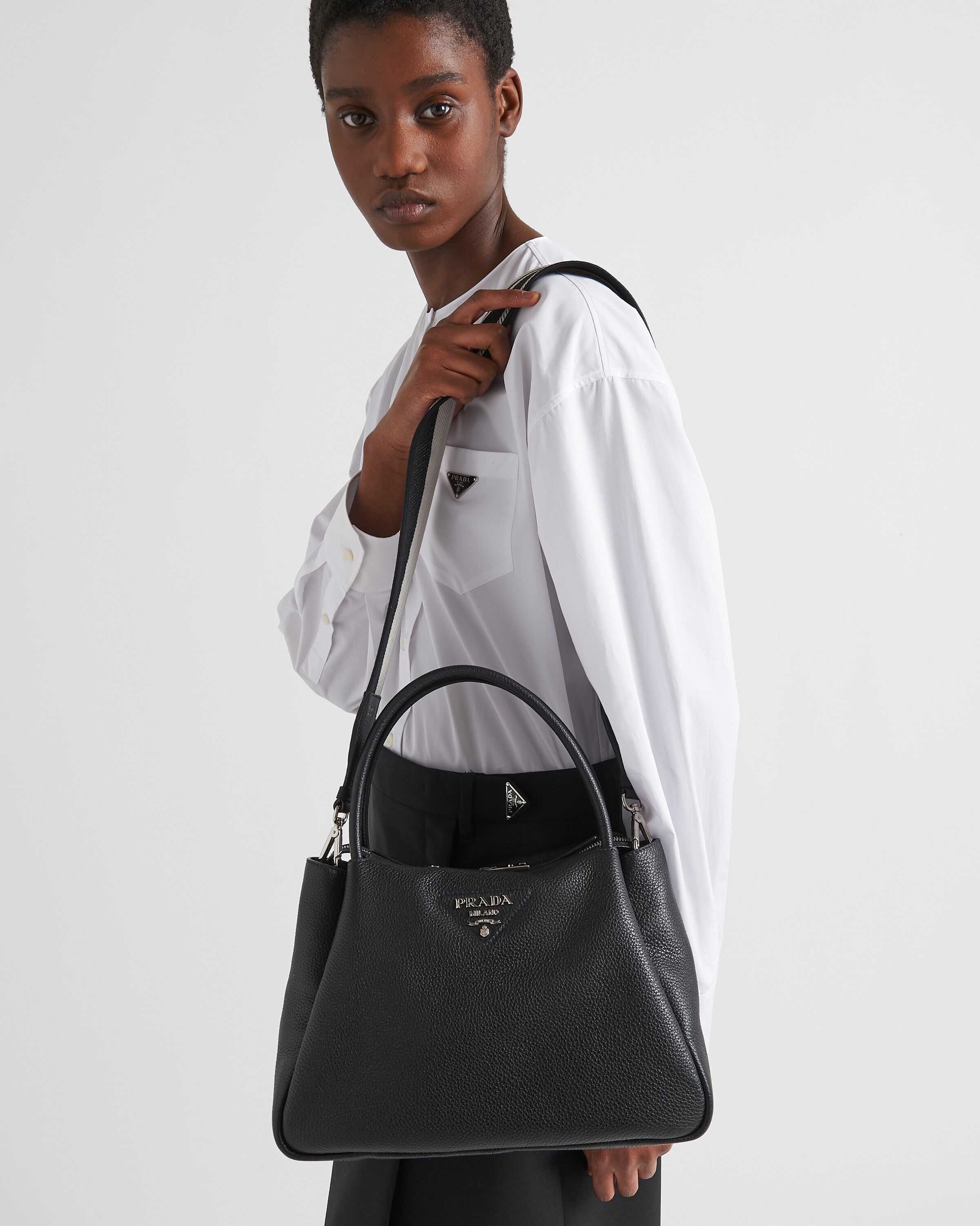 Prada Medium leather handbag Top Handle | Heathrow Reserve Prada Medium leather handbag Top Handle | Heathrow Reserve