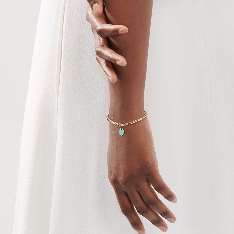 Return to Tiffany&trade; mini heart tag on a bead bracelet in 18k gold, , hi-res