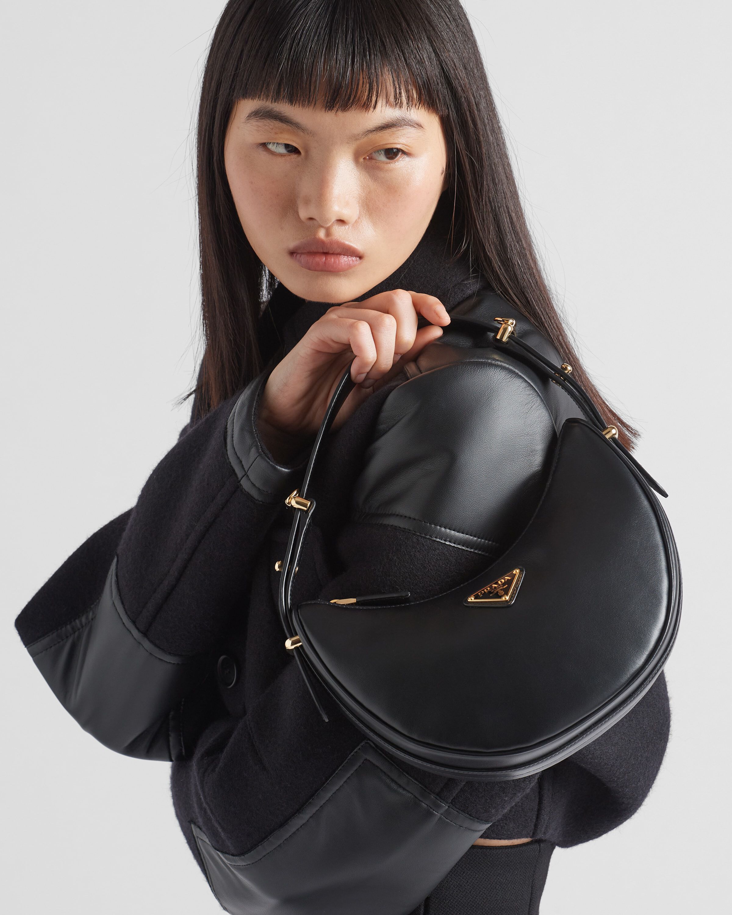 Prada Prada Arqué small leather shoulder bag Women | Heathrow