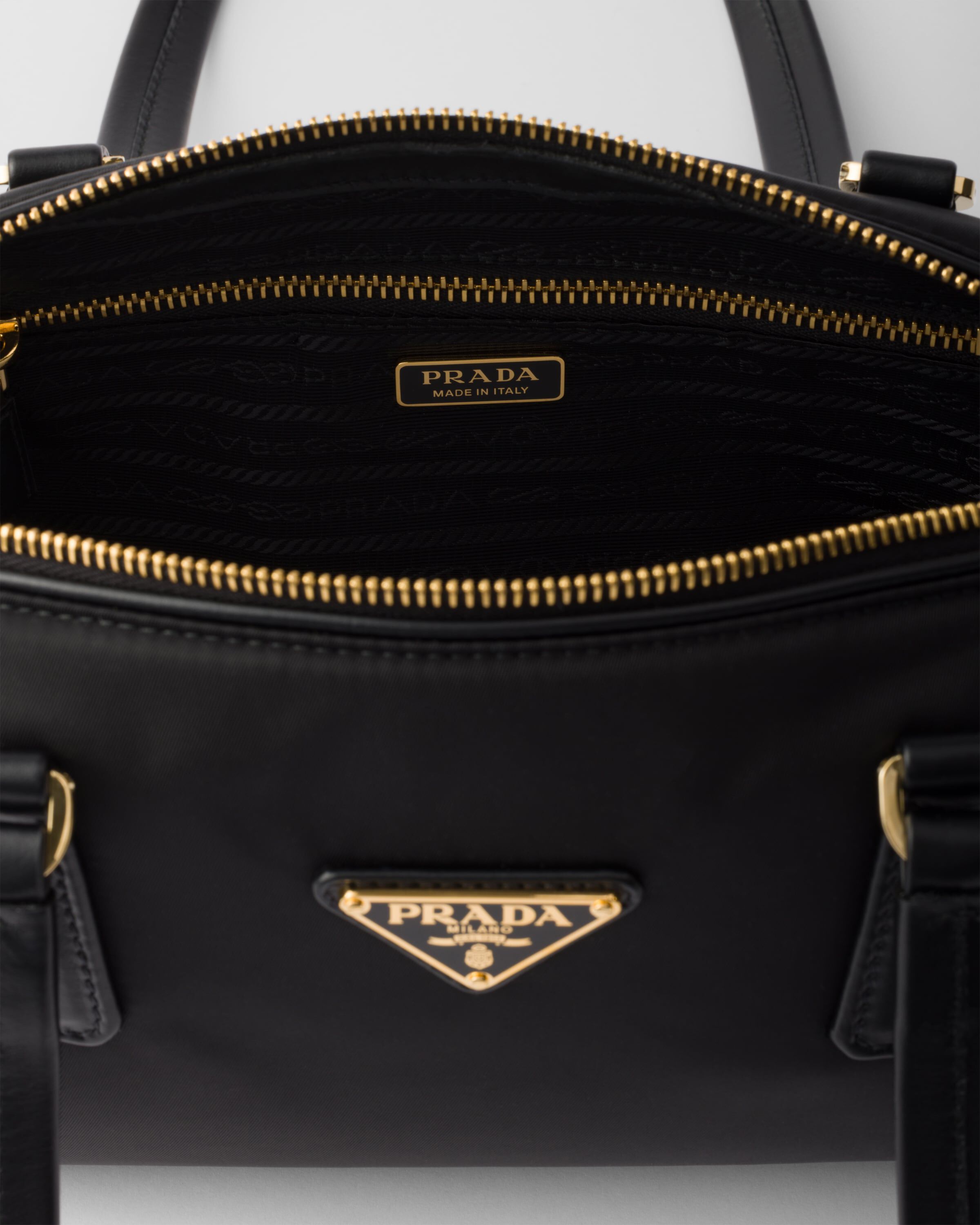 Prada bag with lock best sale