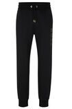 Cotton-terry tracksuit bottoms with monogram-filled logo, , hi-res