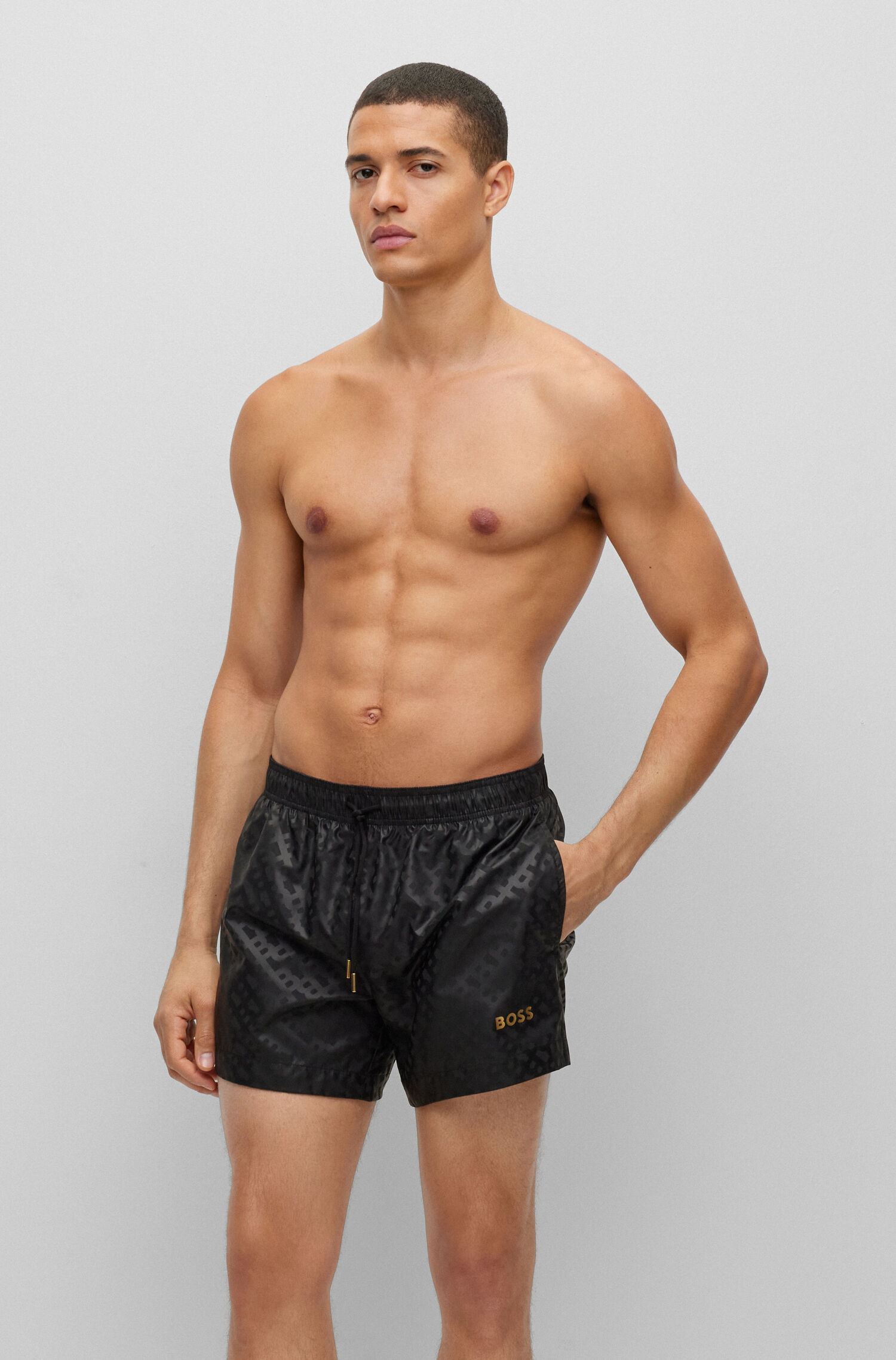 Quick-dry monogram-print swim shorts in recycled fabric