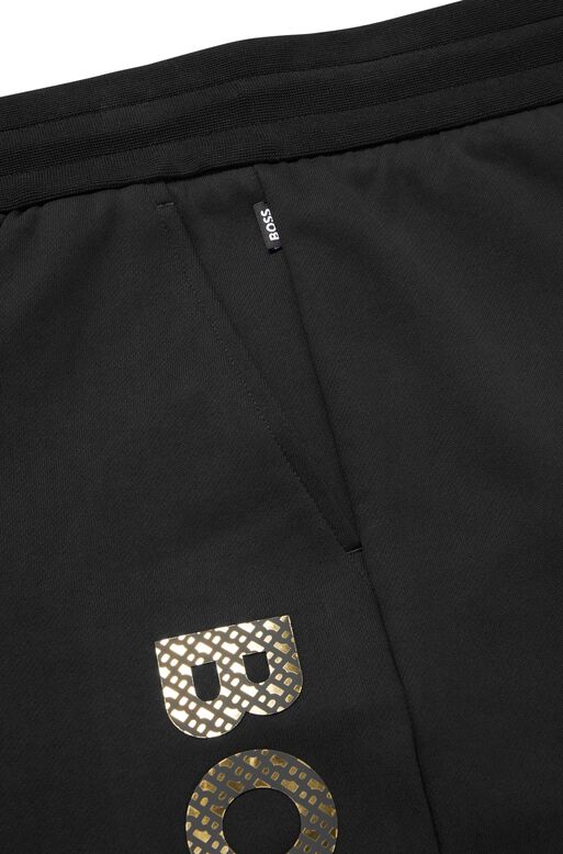 Cotton-terry tracksuit bottoms with monogram-filled logo, , hi-res