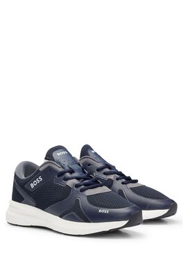 Mixed-material trainers with mesh and branding