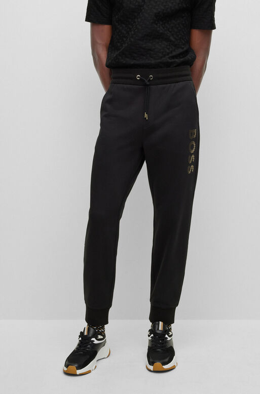 Cotton-terry tracksuit bottoms with monogram-filled logo, , hi-res