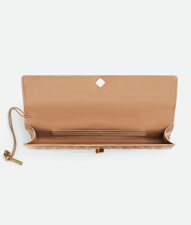 Top handle clutch in Intrecciato leather with signature knot closure., , hi-res