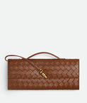 Top handle clutch in Intrecciato leather with signature knot closure.
