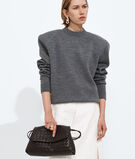 Pouch in Intrecciato leather with flap and drawstring closure, featuring a loop attachment for shoulder carry. , , hi-res