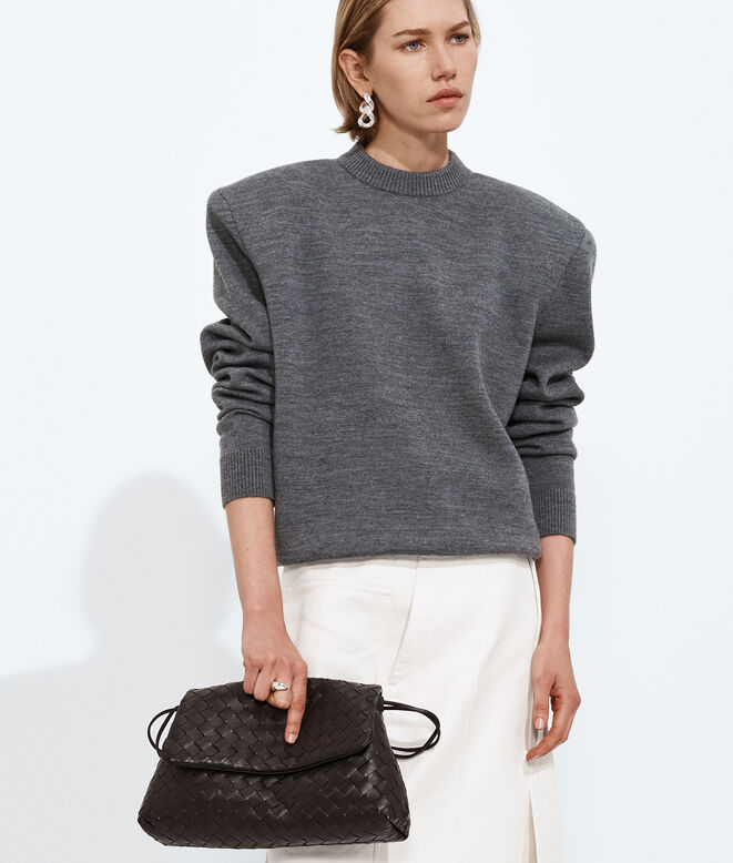 Pouch in Intrecciato leather with flap and drawstring closure, featuring a loop attachment for shoulder carry. , , hi-res