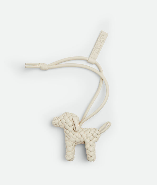 Charm realised in Intreccio nappa leather with dog shape, featuring a leather lanyard., , hi-res