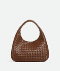 Shoulder bag with archival silhouette in supple Intrecciato leather with tie closure.