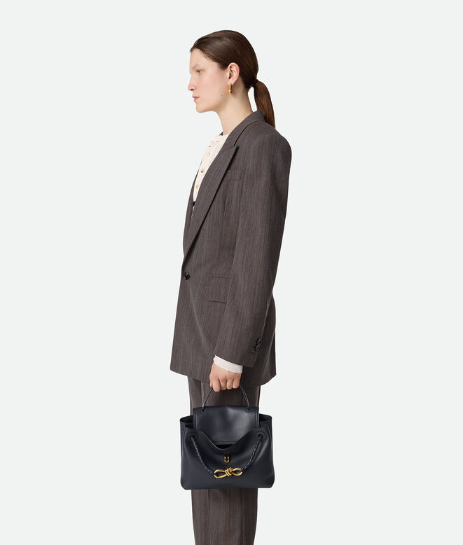 Top handle bag in silky calf leather with two-way flap and signature knot detail. Features a hidden hook closure, allowing the flap to be closed in the front or attached to the interior Intrecciato pocket., , hi-res