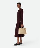 Top handle bag in supple Intrecciato leather with signature knot detail and sliding cross-body strap., , hi-res