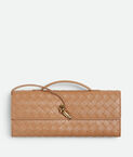 Top handle clutch in Intrecciato leather with signature knot closure.