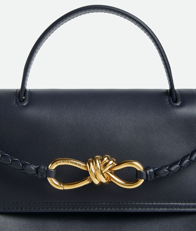 Top handle bag in silky calf leather with two-way flap and signature knot detail. Features a hidden hook closure, allowing the flap to be closed in the front or attached to the interior Intrecciato pocket., , hi-res