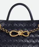 Top handle bag in Intrecciato leather with signature knot detail and tubular leather braided metal chain., , hi-res