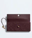 Top handle clutch in supple Intrecciato suede with signature knot closure., , hi-res