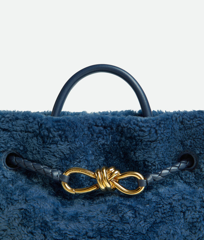 Top handle bag in merino shearling with denim effect. Featuring signature knot detail and sliding cross-body strap., , hi-res