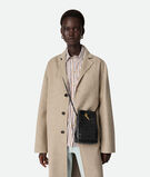 Phone pouch in Intrecciato nappa leather with signature knot closure and sliding strap., , hi-res