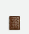 Small bi-fold wallet in Intrecciato nappa leather with contrasted interior.