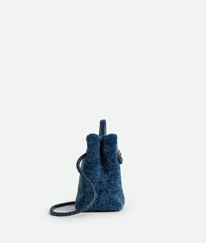 Top handle bag in merino shearling with denim effect. Featuring signature knot detail and sliding cross-body strap., , hi-res