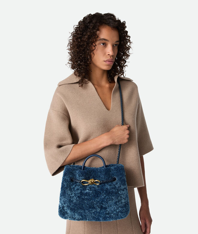 Top handle bag in merino shearling with denim effect. Featuring signature knot detail and sliding cross-body strap., , hi-res