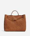 Top handle bag in Intrecciato suede with signature knot detail and sliding cross-body strap.