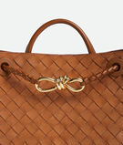 Top handle bag in Intrecciato suede with signature knot detail and sliding cross-body strap., , hi-res