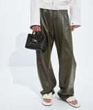 Top handle bag in supple Intrecciato leather with signature knot detail and sliding cross-body strap., , hi-res