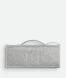 Top handle clutch in supple leather with all-over crystal detailing and signature knot closure., , hi-res