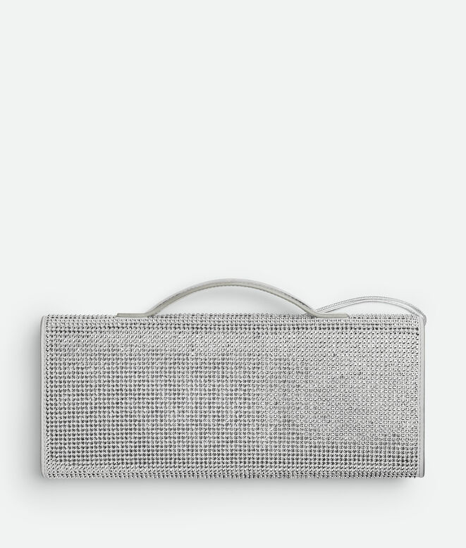 Top handle clutch in supple leather with all-over crystal detailing and signature knot closure., , hi-res