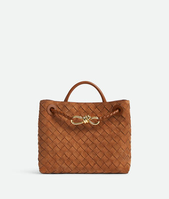 Top handle bag in Intrecciato suede with signature knot detail and sliding cross-body strap.,