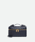 Vanity case in Intrecciato leather with detachable strap.