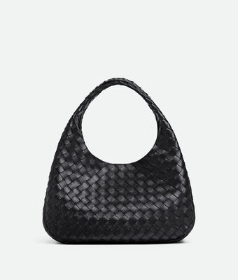 Shoulder bag with archival silhouette in supple Intrecciato leather with tie closure.,