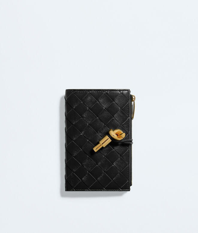 Medium bi-fold wallet in Intrecciato nappa leather, featuring a signature knot detail., , hi-res
