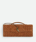 Top handle clutch in Intrecciato suede with signature knot closure.