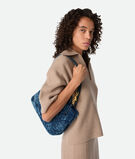 Top handle bag in merino shearling with denim effect. Featuring signature knot detail and sliding cross-body strap., , hi-res