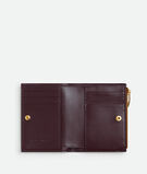 Small bi-fold wallet in Intrecciato nappa leather with contrasted interior., , hi-res
