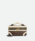 Vanity case in aviator merino shearling with detachable strap.