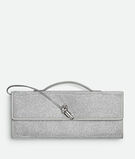 Top handle clutch in supple leather with all-over crystal detailing and signature knot closure., , hi-res