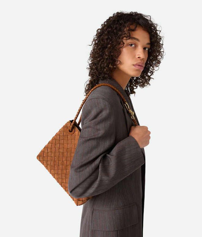 Top handle bag in Intrecciato suede with signature knot detail and sliding cross-body strap., , hi-res