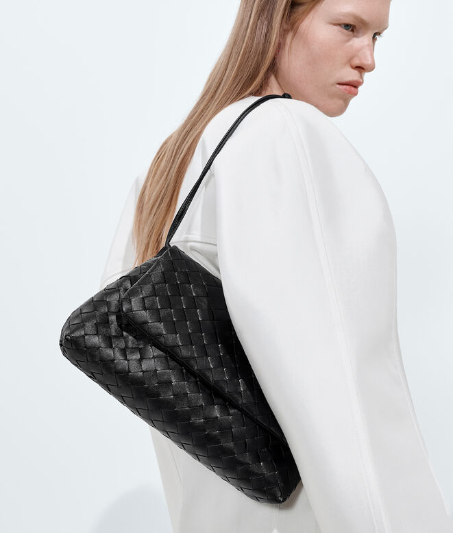 Pouch in Intrecciato leather with flap and drawstring closure, featuring a loop attachment for shoulder carry., , hi-res