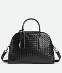 Briefcase with curved silhouette in soft Intrecciato leather with adjustable and detachable strap, featuring a signature knot detail.